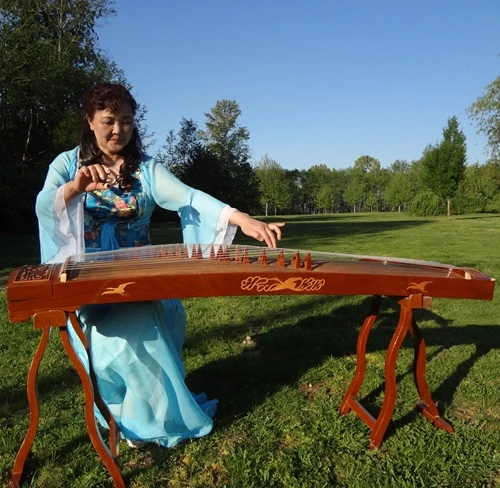 Portrait of Chinese musician Laura Wu with her Guzheng in Stanley Park.